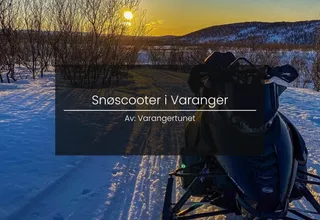 Snowmobile trip in the open landscape of Varanger